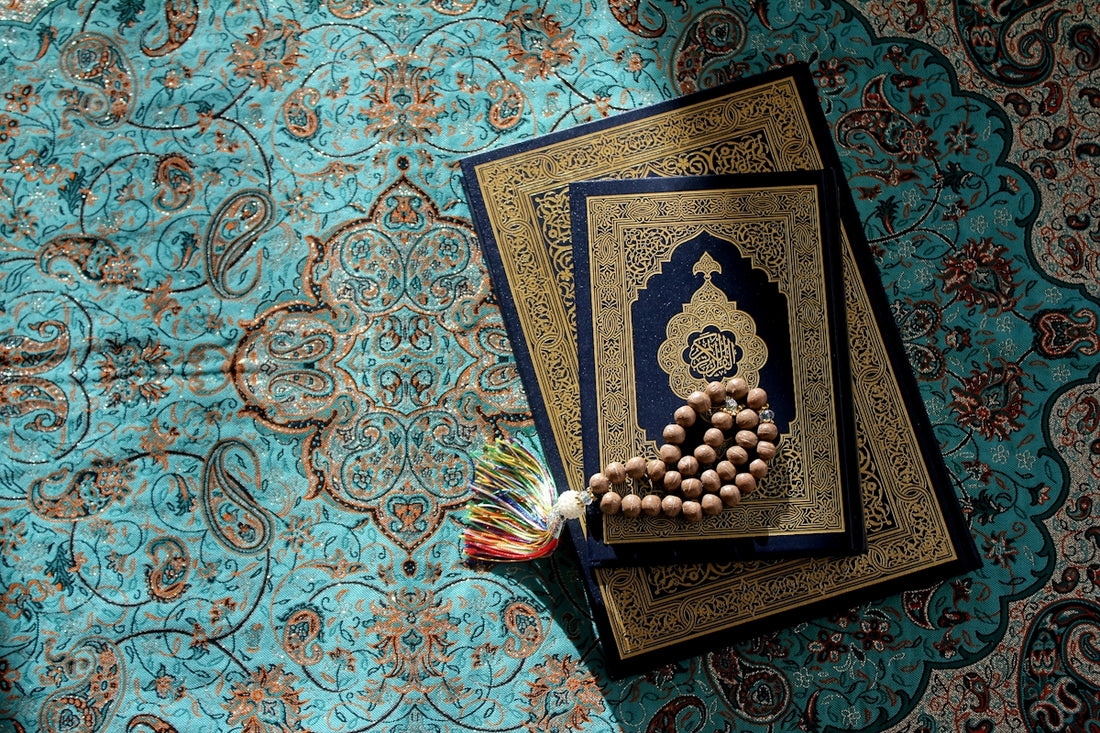 a rosary laying on top of a book